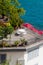 View of beautiful table with white chairs stands on the balkon. Decoration from flowers. Location for her morning photo session