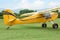 View of beautiful ultralight airplane in field on autumn day