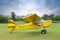 View of beautiful ultralight airplane in field on autumn day