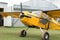 View of beautiful ultralight airplane near hangar in field