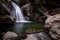 View of a beautiful waterfall in the forest. Bingham Falls Stowe USA.