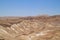 View of Bedouin camp in a wadi of the Judean Desert, with Dead Sea in background as seen from Masada Fortress