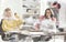 View from behind glass.couple designers sitting at a Desk in the Studio