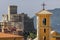 View of the bell tower of the Church of San Francesco with the Castle of Lerici in the background, La Spezia, Liguria, Italy