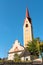 View of the bell tower of the Parish Church of Saints Ingenuino and Albuino  in Monguelfo-Tesido, province of Bolzano, South Tyrol