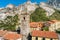 View of the bell tower of Sant Bartolomeo church in ancient village Colonnata in Tuscany, Italy