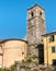 View of the bell tower of Sant Bartolomeo church in ancient village Colonnata in Tuscany, Italy