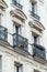 View from below on a facade European building with balconies in Paris