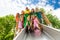 View from below of many kids on playground chute