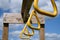 View From Below of Monkey Bar Rings Hanging From Wooden Beam