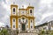 View from below of old church between the houses and streets of the city of Ouro Preto