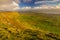 View from Benbulben on green fields in Sligo with blue sky