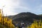 View at Bernkastel-Kues and Landshut castle on the river Moselle in autumn with multi colored vineyard in the foreground