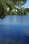 View of the Biesdorfer Baggersee lake with magnificent vegetation in August. Berlin, Germany