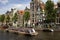 View of a big cruise canal tour boat, trees