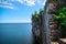 View of big long rocky cliff standing in Cyprus lake against blue bright sky at beautiful gorgeous Bruce Peninsula, Ontario