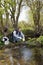 View of a Biologist take a sample in a river.