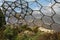 A view of a biome at the Eden Project in Cornwall, England. A maintenance platform is visible and the surrounding hillside is in