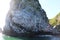 View of bird colony on the rock of Starichkov island by the Kamchatka Peninsula, Russia.