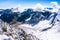 view from the birds-eye over the mountains and clouds