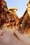 View of the Bizarre rock formations in the GÃ¶reme Valley between the rocks. Sandy desert landscape.