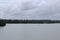 View of the Black river with a small boat sailing