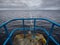 View from Blackrock diving board on Atlantic ocean and Burren mountains in the background. Cloudy dramatic sky. Salthill area of