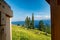 View of Bled lake, Triglav National Park and Jesenice town in sunset clouds - Julian Alps, Slovenia and view from outhouse latrine