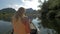 View of blond woman with camera on the boat. Excursion in Halong bay, boat island tours. Hanoi, Vietnam