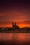 View of bloody sunset in front of cathedral in Magdeburg and river Elbe, Germany, Summer