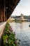 View of blooming Pelargonium flower rows from the famous Chapel Bridge in Lucerne Switzerland