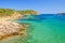 View on the blue lagoon on the beach Es Grau on Menorca
