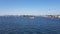 View of the blue ocean and coastline. View of the city and the ocean from the board of the ship.