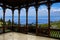 View of blue sea and green valley in the mountains from wooden openwork gallery or gazebo in Croatia. Mountain landscape
