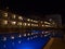 View of the blue shimmering swimming pool of holiday resort in Puerto Rico, southern Gran Canaria, Spain at night.