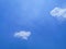 View of the blue sky and cloud on the airplain from window with nature flaire and fog