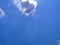 View of the blue sky and cloud on the airplain from window with nature flaire and fog