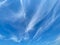 View into blue sky with thin whispy strands cirrus clouds