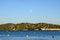 View on blue water of Gulf of Saint-Tropez, sail boats, houses of Saint Tropez, summer vacation in Provence, France