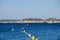 View on blue water of Gulf of Saint-Tropez, sail boats, houses of Saint Tropez, summer vacation in Provence, France