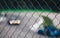 View of blurred racing car from a metal grid - sport background