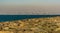 A view from the boardwalk on the Palm Jumeirah complex towards the distant skyline of downtown Dubai, UAE