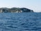 View from a boat on the rocky coast of Antipaxos in Greece