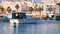 View from the boat tourists to the coastal city, yachts, sea, boats. The ordinary life of Valletta, Malta. Sunny day