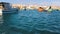 View from the boat tourists to the coastal city, yachts, sea, boats. The ordinary life of Valletta, Malta. Sunny day