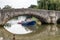 View of a boat under the 14th century bridge at Aylesford on September 6, 2021. Three