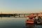 View of the boats and bridge from port at sun rise