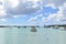 View of boats moored in the beautiful and quiet Grand Bay lagoon, amazing colors. Vacations background.