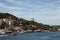 View of boats passing on Bosphorus and Bebek neighborhood on European side of Istanbul. It is a sunny summer day.