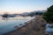 View of Bodrum Beach, Sun loungers and wicker parasols on sandy beach